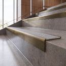 Antique Brass anti-slip stair nosing with Italian marble CarbiGrip insert fitted to concrete steps