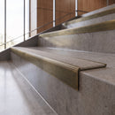 Antique Brass anti-slip stair nosing with Portland stone CarbiGrip insert fitted to concrete steps