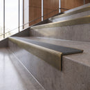 Antique Brass anti-slip stair nosing with storm grey ridged PVC insert fitted to concrete steps