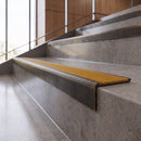 Antique Bronze anti-slip stair nosing with amber CarbiGrip insert fitted to concrete steps