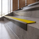Antique Bronze anti-slip stair nosing with canary yellow ridged PVC insert fitted to concrete steps