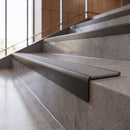 Antique Bronze anti-slip stair nosing with fog grey ridged PVC insert fitted to concrete steps