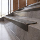 Antique Bronze anti-slip stair nosing with pebble CarbiGrip insert fitted to concrete steps