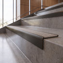 Antique Bronze anti-slip stair nosing with Portland stone CarbiGrip insert fitted to concrete steps