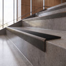 Antique Bronze anti-slip stair nosing with black ridged PVC insert fitted to concrete steps