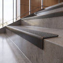 Antique Bronze anti-slip stair nosing with speckled graphite CarbiGrip insert fitted to concrete steps