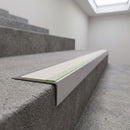 Ramped aluminium stair nosing 66x32mm with photoluminescent strip and a canvas anti-slip PVC insert, fitted to a concrete step