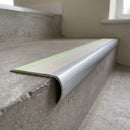 Bullnose aluminium stair nosing 69x40mm with photoluminescent strip and a canvas anti-slip PVC insert, fitted to a concrete step
