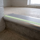 Bullnose aluminium stair nosing 69x40mm with photoluminescent strip and a dolphin grey anti-slip PVC insert, fitted to a concrete step