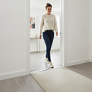 49mm wide aluminium door threshold strip in Silver — installed between floors at UK home doorway with person using it