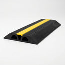 Low profile two channel rubber floor cable cover 107 by 20mm with yellow top strip, both cable channels visible at the open end
