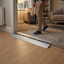 Adjustable aluminium floor ramp in matt silver finish, extending 0.9m to 2.8m for indoor and outdoor use