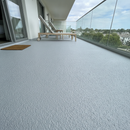 Light Grey TerraceShield anti-slip balcony paint applied to a balcony floor, a hotel balcony with sun loungers