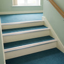 Beige PVC insert fitted in aluminium stair nosings on a care home staircase