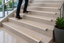 Beige anti-slip insert on a semi-rounded bullnose stair nosing