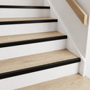 Black anodised push-in LVT stair nosing 28x14.5mm fitted on light oak vinyl treads with white painted risers