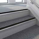 Black PVC insert fitted in aluminium stair nosings on an office stairwell