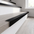 Black anodised self-adhesive stair nosing 25x20mm fitted on grey oak vinyl stairs
