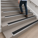 Black rubber anti-slip insert detail on DDA aluminium stair nosing