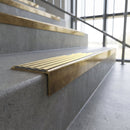 Solid brass stair nosing, 59.5mm tread with a 30mm square front, in Antique Brass finish with Satin Brass insert, fitted to a staircase