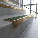 Solid brass stair nosing, 59.5mm tread with a 30mm square front, in Antique Brass finish with Spruce Castellated insert, fitted to a staircase