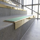 Solid brass stair nosing, 59.5mm tread with a 30mm square front, in Polished Brass finish with Jade Castellated insert, fitted to a staircase