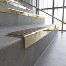 Solid brass stair nosing, 59.5mm tread with a 30mm square front, in Polished Brass finish with Peat Castellated insert, fitted to a staircase