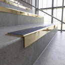 Solid brass stair nosing, 59.5mm tread with a 30mm square front, in Polished Brass finish with Regency Castellated insert, fitted to a staircase