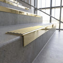 Solid brass stair nosing, 59.5mm tread with a 30mm square front, in Polished Brass finish with Satin Brass insert, fitted to a staircase