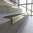 Solid brass stair nosing, 59.5mm tread with a 30mm square front, in Polished Brass finish with Spruce Castellated insert, fitted to a staircase