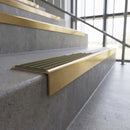 Solid brass stair nosing, 59.5mm tread with a 30mm square front, in Satin Brass finish with Antique Bronze insert, fitted to a staircase