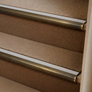Antique Brass finish with Polar Grey Castellated insert - 63.5mm solid brass bullnose stair nosing fitted to a carpeted step
