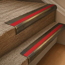 Antique Brass finish with Poppy Castellated insert - 63.5mm solid brass bullnose stair nosing fitted to a carpeted step