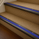 Antique Bronze finish with Mid Blue Castellated insert - 63.5mm solid brass bullnose stair nosing fitted to a carpeted step