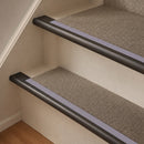 Antique Bronze finish with Nimbus Castellated insert - 63.5mm solid brass bullnose stair nosing fitted to a carpeted step