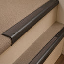 Antique Bronze finish with Peat Castellated insert - 63.5mm solid brass bullnose stair nosing fitted to a carpeted step