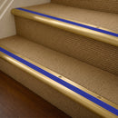 Satin Brass finish with Mid Blue Castellated insert - 63.5mm solid brass bullnose stair nosing fitted to a carpeted step