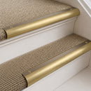 Satin Brass finish with Polished Brass insert - 63.5mm solid brass bullnose stair nosing fitted to a carpeted step
