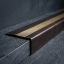 BN71SLR solid brass stair nosing in Antique Bronze finish with Antique Brass insert, fitted to a step edge