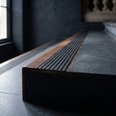 BN71SLR solid brass stair nosing in Antique Bronze finish with Black Olympic Grip insert, fitted to a step edge