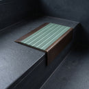 BN71SLR solid brass stair nosing in Antique Bronze finish with Jade Castellated insert, fitted to a step edge