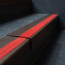 BN71SLR solid brass stair nosing in Antique Bronze finish with Poppy Castellated insert, fitted to a step edge