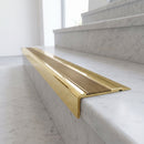 BN71SLR solid brass stair nosing in Polished Brass finish with Antique Brass insert, fitted to a step edge