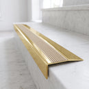 BN71SLR solid brass stair nosing in Polished Brass finish with Fawn Castellated insert, fitted to a step edge