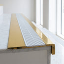 BN71SLR solid brass stair nosing in Polished Brass finish with Polar Grey Castellated insert, fitted to a step edge