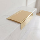 BN71SLR solid brass stair nosing in Polished Brass finish with Porth Stone Smooth Textured insert, fitted to a step edge