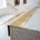 BN71SLR solid brass stair nosing in Polished Brass finish with Satin Brass insert, fitted to a step edge