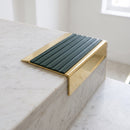 BN71SLR solid brass stair nosing in Polished Brass finish with Spruce Castellated insert, fitted to a step edge