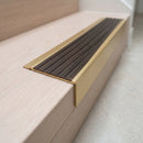 BN71SLR solid brass stair nosing in Satin Brass finish with Antique Bronze insert, fitted to a step edge