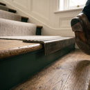 Solid brass stair nosing, 59.5mm tread with a 30mm square front, in Antique Brass finish, fitted to a staircase